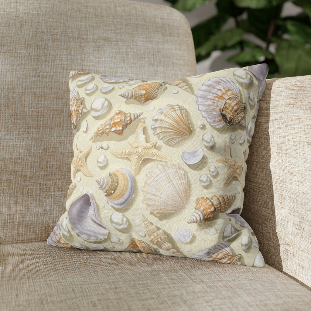 Decorative pillow with shell pattern on a couch.