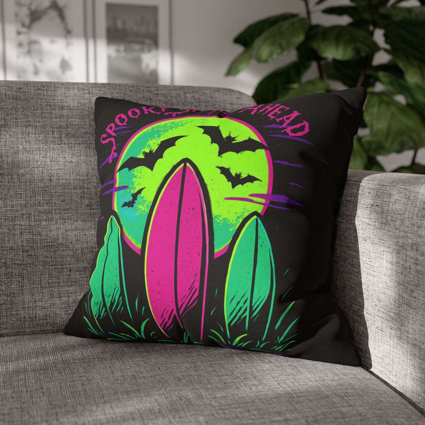 Decorative pillow with Halloween design on a gray couch