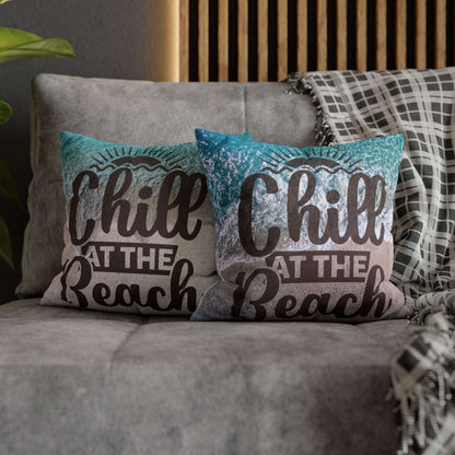 Two 14" x 14" decorative pillows with 'Chill at the Beach' text on a beach background. 