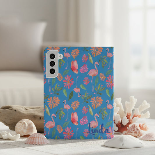 Flip phone case with flamingo and floral design on a blue background and personalized with name.