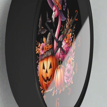 Halloween-themed clock with a pink flamingo, pumpkins, and flowers on a black background.