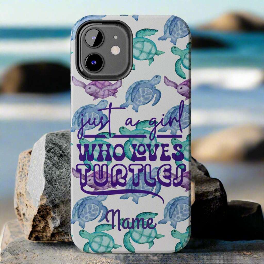 Phone case with sea turtle design and text 'Just a girl who loves turtles' on a gray background