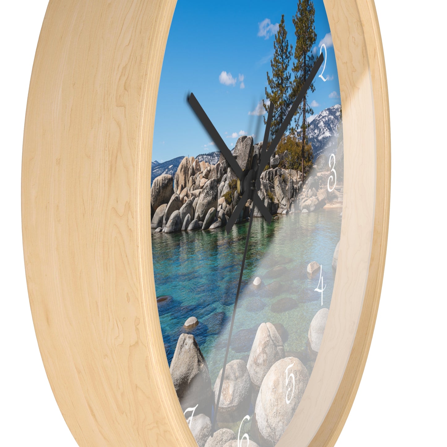 Wall clock with a scenic design of a lake and trees on a white background