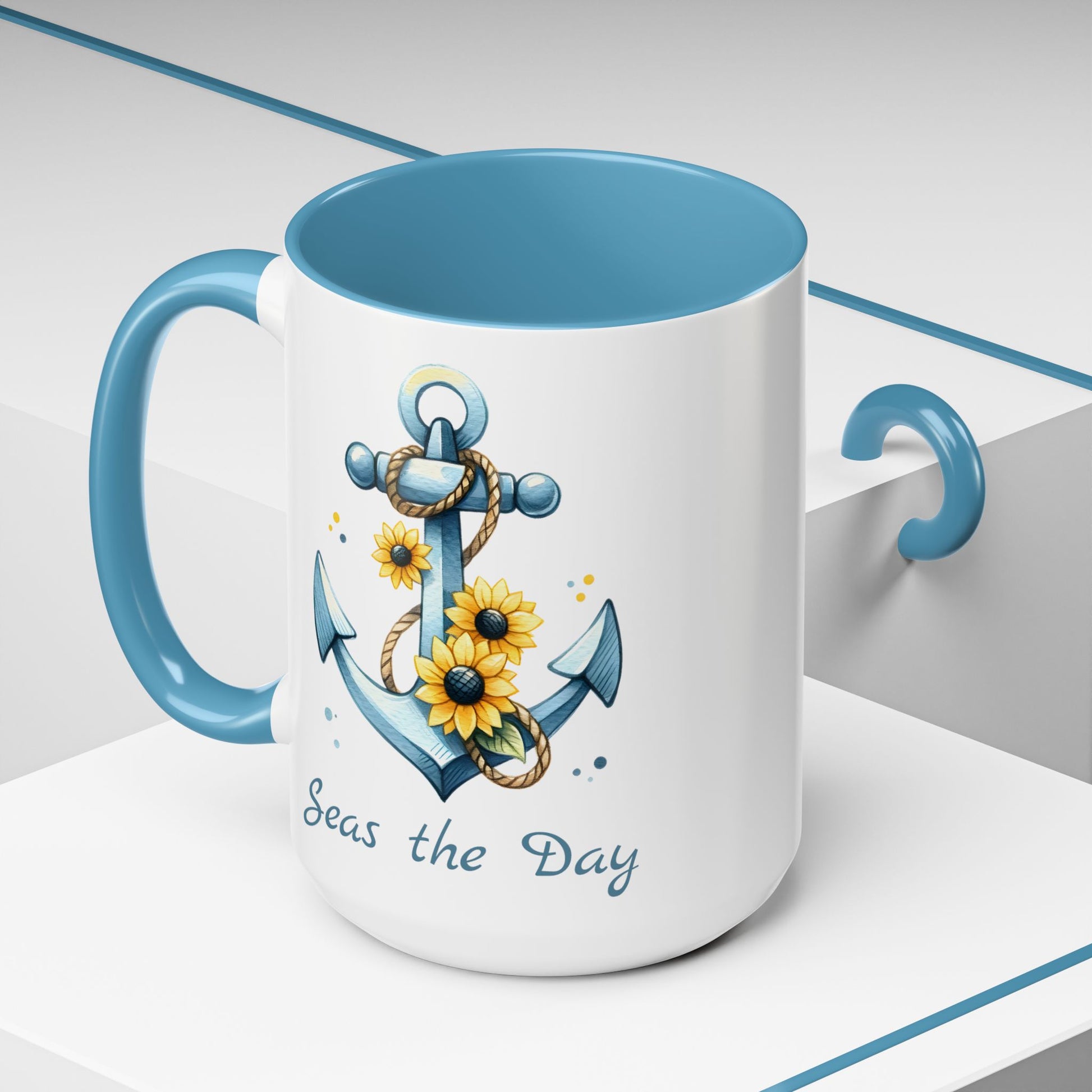 15 oz  White mug with baby blue handle and interior with Anchor and Sunflowers with text Seas the Day