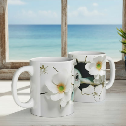 Two floral mugs on a desk with a laptop and office supplies.