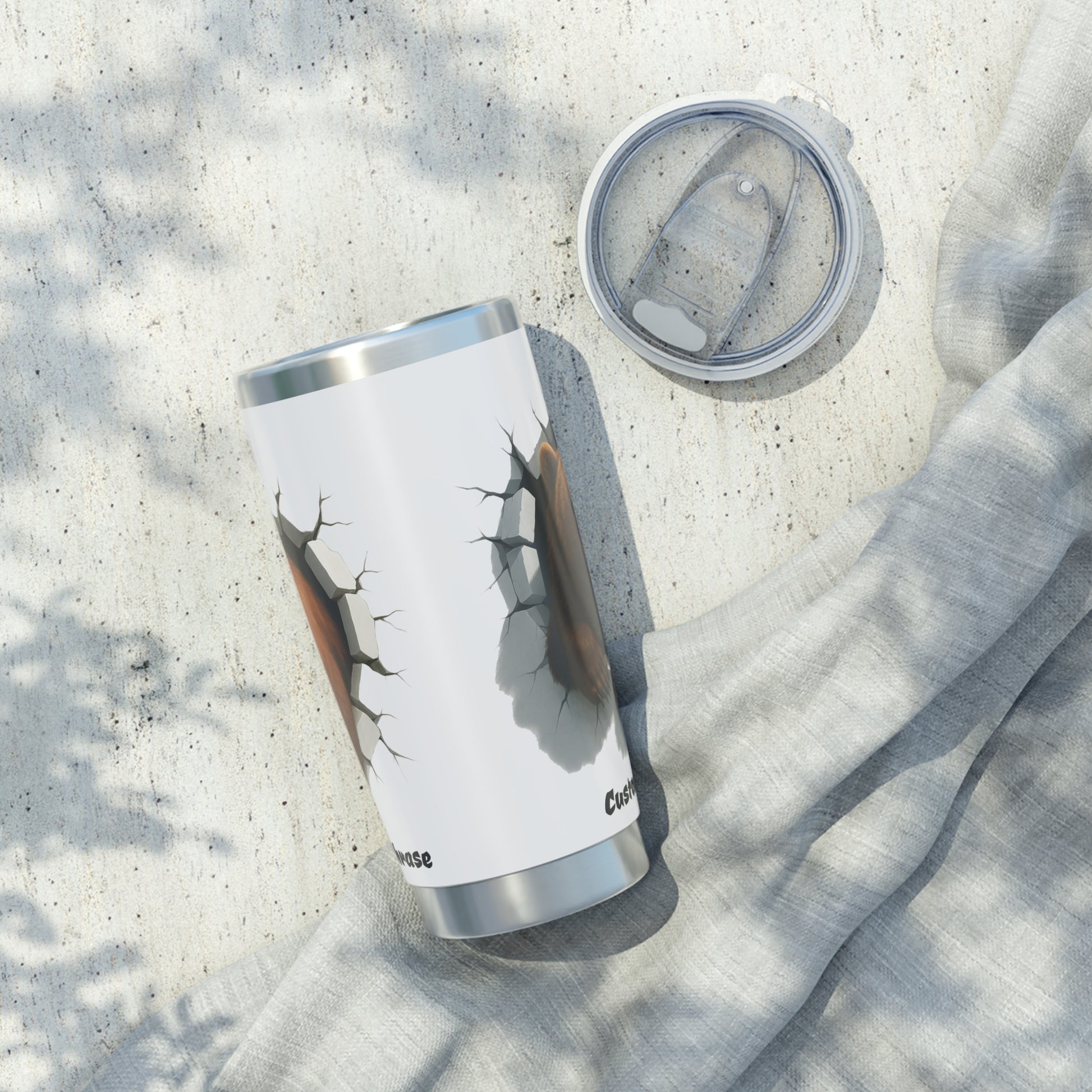 White tumbler with a cracked wall with a bear design.