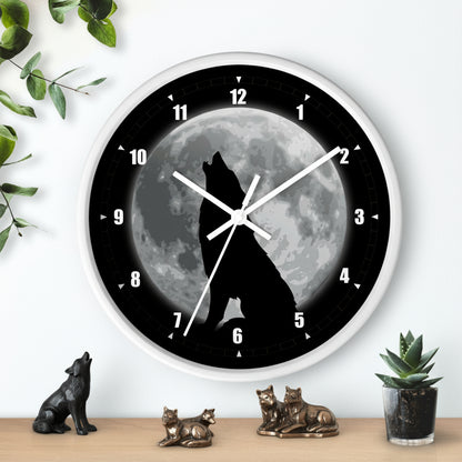 Wall clock with a wolf howling at the moon design on a white background