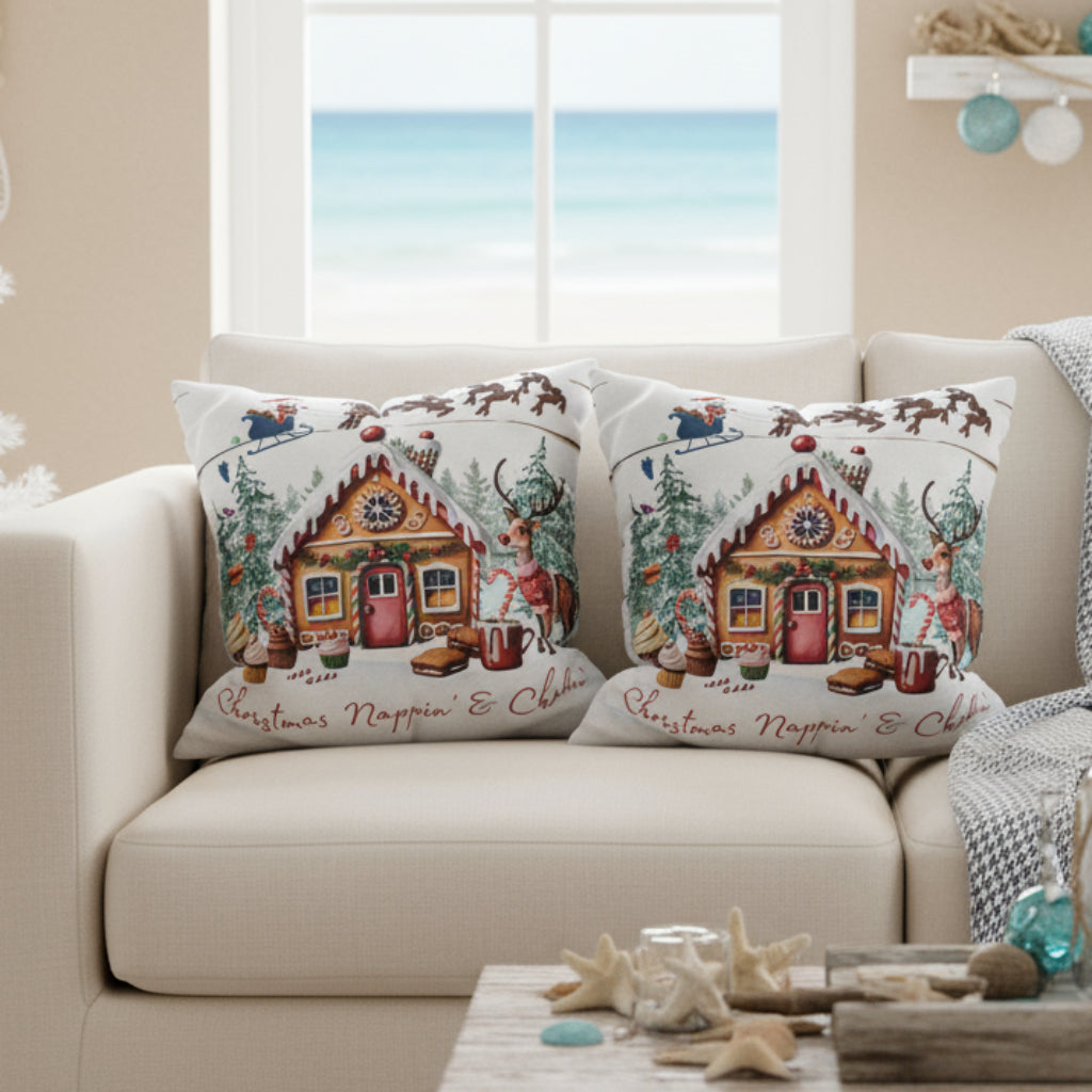 Decorative pillows with gingerbread house design on a  sofa.