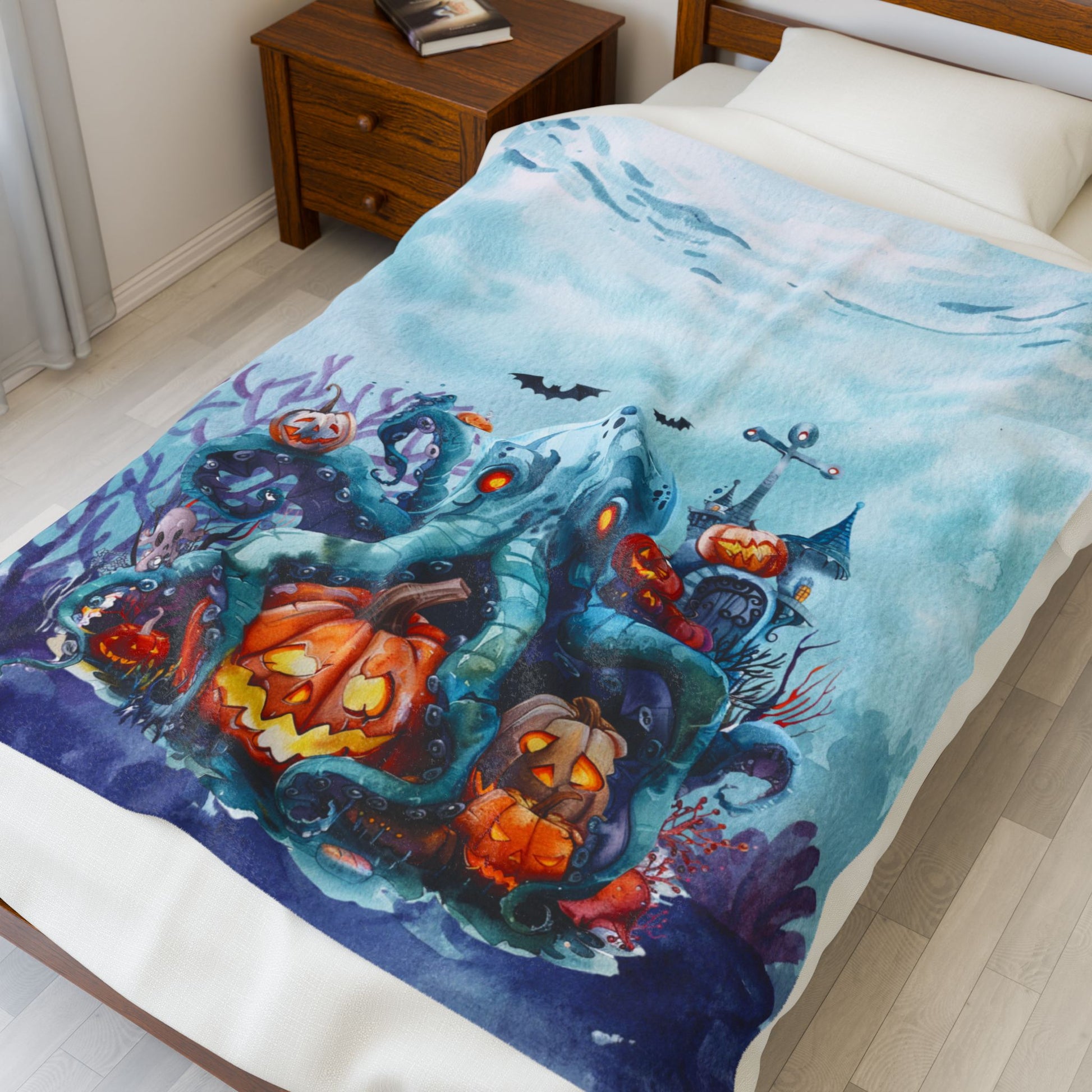 Light blue spooky plush 50" x 60" blanket featuring octopus and underwater Halloween scene.