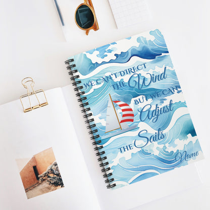 Sprial-bound notebook with waves and red and white sailboat and text We Can't Direct the Winds But We can adjust the sails.