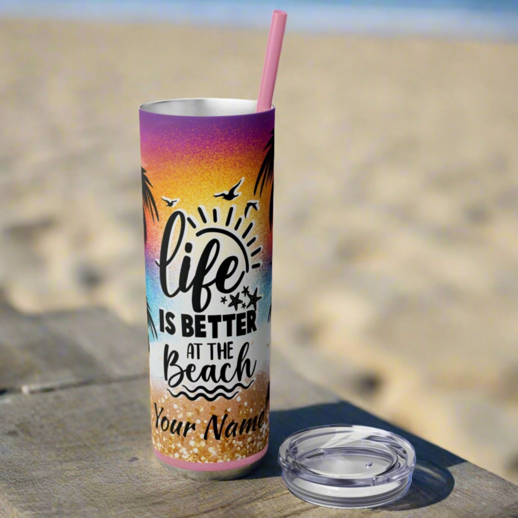 skinny 20 oz tumbler with vibrant design of beach with text life is better at the beach