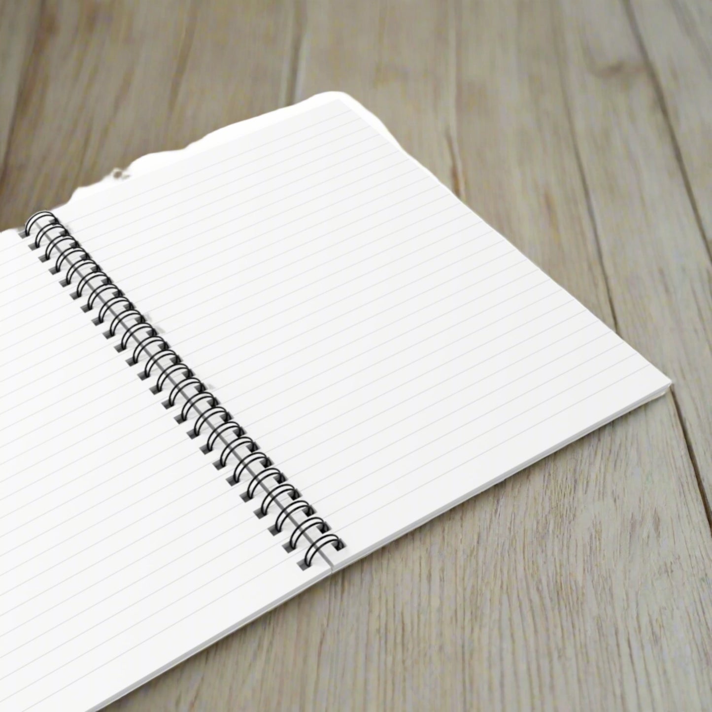 Open spiral notebook showing lined pages