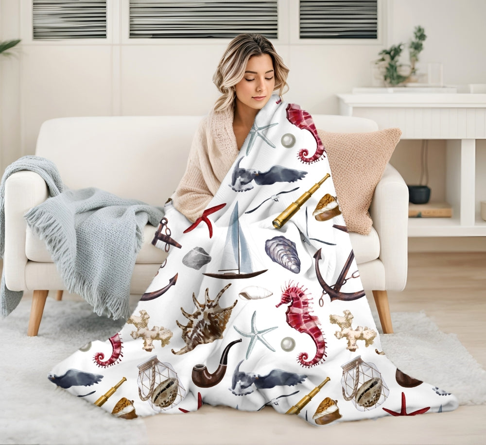 white blanket with nautical graphics