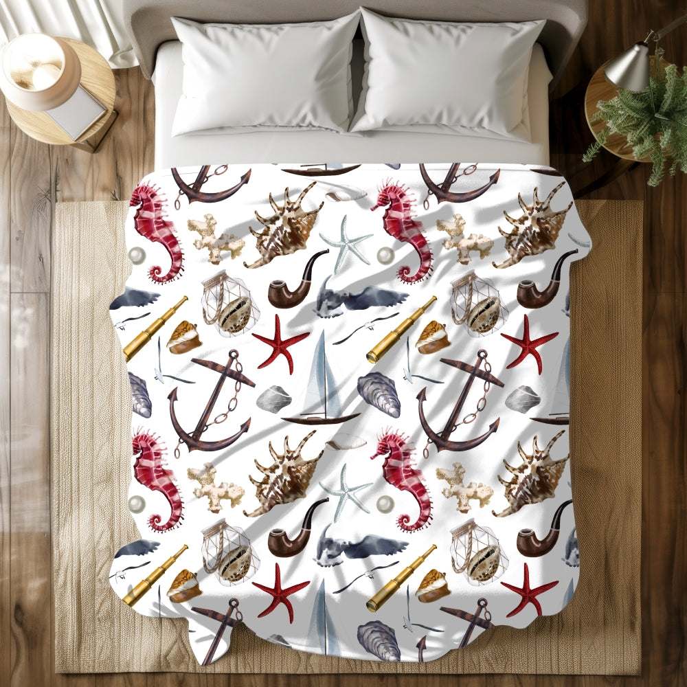 white blanket with nautical graphics