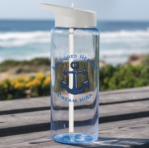 Clear water bottle with a blue anchor and the words Anchored Hearts and Dream High surrounding the anchor.