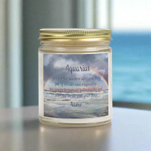 Elegant Scorpio Zodiac hand-poured coconut apricot wax scented candle in a 9 oz clear glass jar with gold lid, featuring a picture of a rainbow over the ocean and an inspirational quote personalized. A beach-inspired astrology gift, perfect for relaxation and decor.