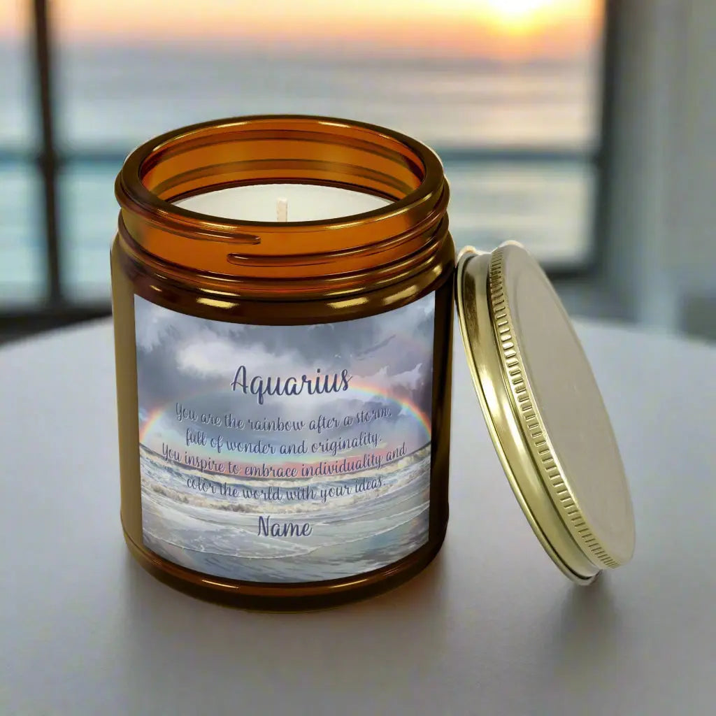Elegant Scorpio Zodiac hand-poured coconut apricot wax scented candle in a 9 oz amber glass jar with a gold lid, featuring a picture of a rainbow over the ocean and an inspirational quote personalized. A beach-inspired astrology gift, perfect for relaxation and decor.