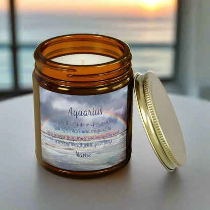 Elegant Scorpio Zodiac hand-poured coconut apricot wax scented candle in a 9 oz amber glass jar with a gold lid, featuring a picture of a rainbow over the ocean and an inspirational quote personalized. A beach-inspired astrology gift, perfect for relaxation and decor.