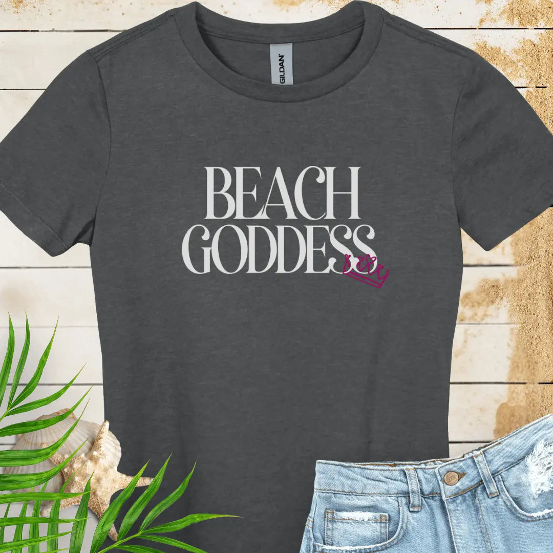 Dark heather Women's T-Shirt with the text Beach Goddess with a crown hanging off of the bottom of the text -stylish tee is great for vacations, beach days, or casual wear.
