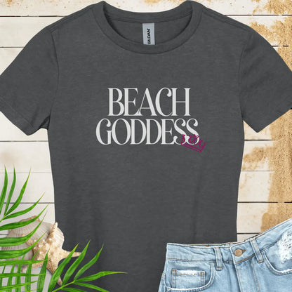 Dark heather Women's T-Shirt with the text Beach Goddess with a crown hanging off of the bottom of the text -stylish tee is great for vacations, beach days, or casual wear.