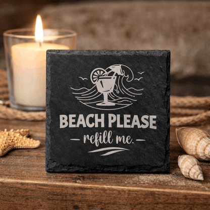 Square black slate coaster engraved “Beach Please refill me” with tropical drink and wave icon.