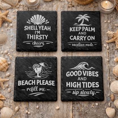 Set of four black square slate beach quote coasters engraved with “Shell Yeah I’m Thirsty,” “Keep Palm and Carry On,” “Beach Please refill me,” and “Good Vibes and High Tides.”