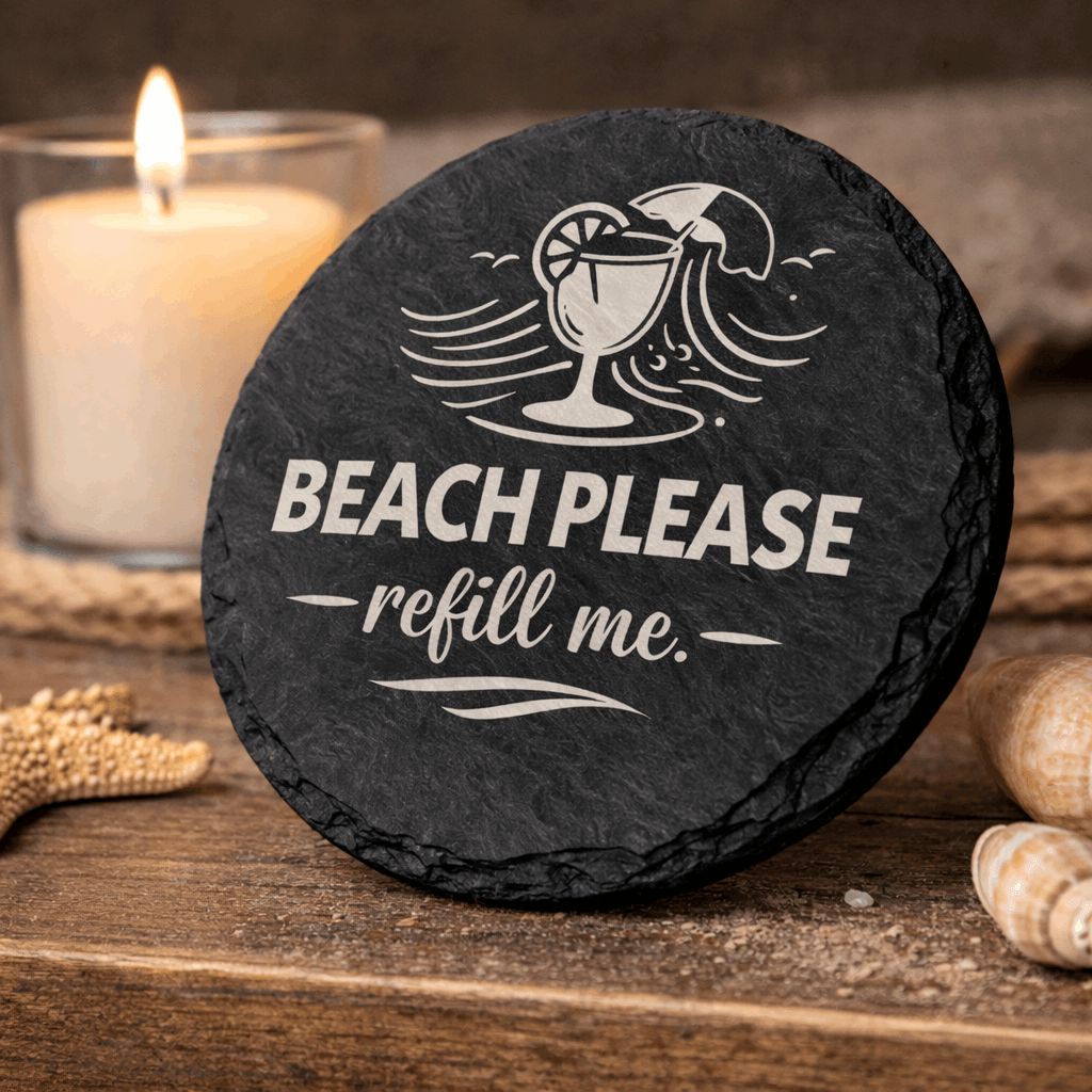 Round black slate coaster engraved “Beach Please refill me” with tropical drink and wave icon.