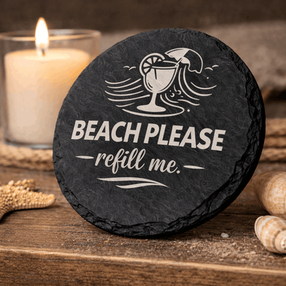 Round black slate coaster engraved “Beach Please refill me” with tropical drink and wave icon.