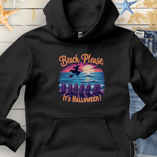 Black Hoodie with image of witch flying on a broom over the ocean with surfboards in the sand and text that says Beach Please, It's Halloween.