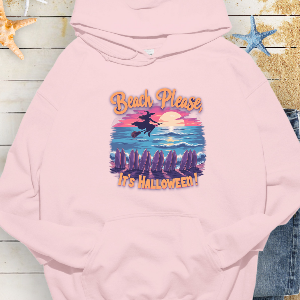 Light Pink Hoodie with image of witch flying on a broom over the ocean with surfboards in the sand and text that says Beach Please, It's Halloween.