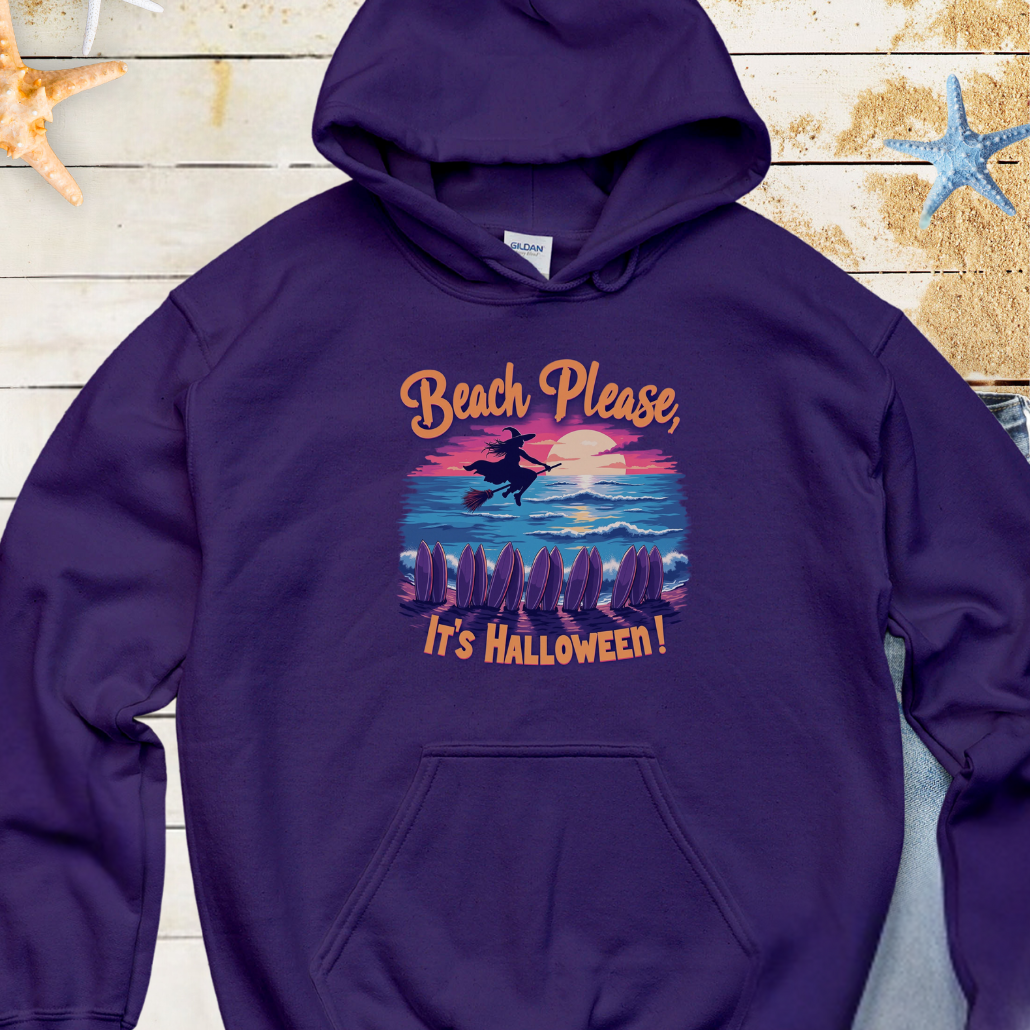 Navy Hoodie with image of witch flying on a broom over the ocean with surfboards in the sand and text that says Beach Please, It's Halloween.