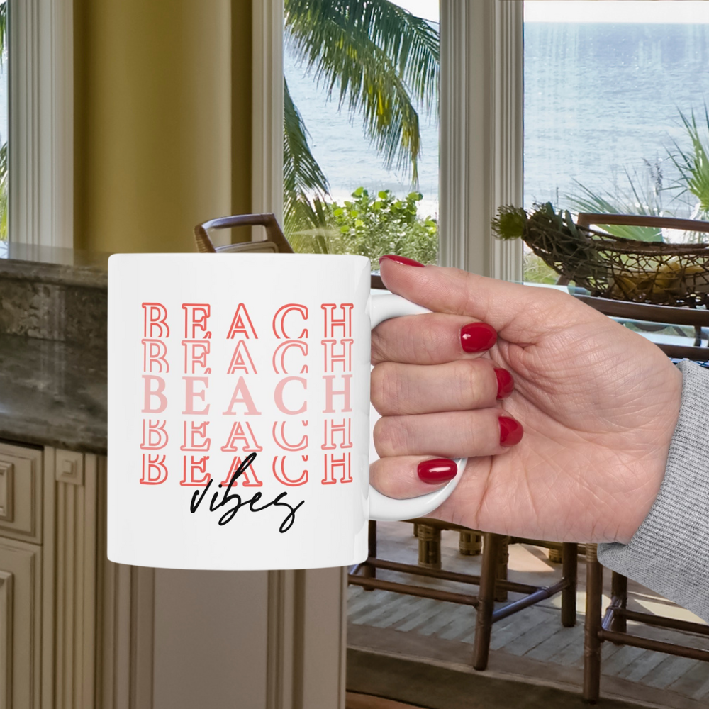 White 11 oz. Mug with Beach Repeated 5 times and Vibes written at bottom.