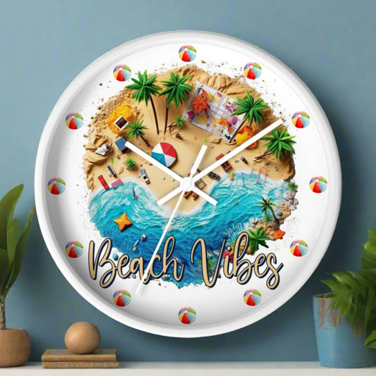 A round wall clock with a white frame, and white hands with a beach scene that says Beach Vibes and has beach balls in place of the numbers to show the time.