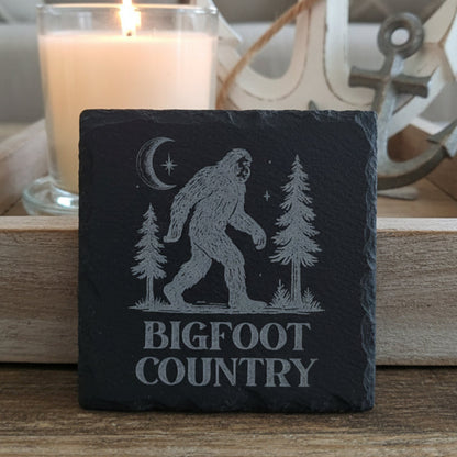 Slate coaster with engraved Bigfoot design and 'Bigfoot Country' text.