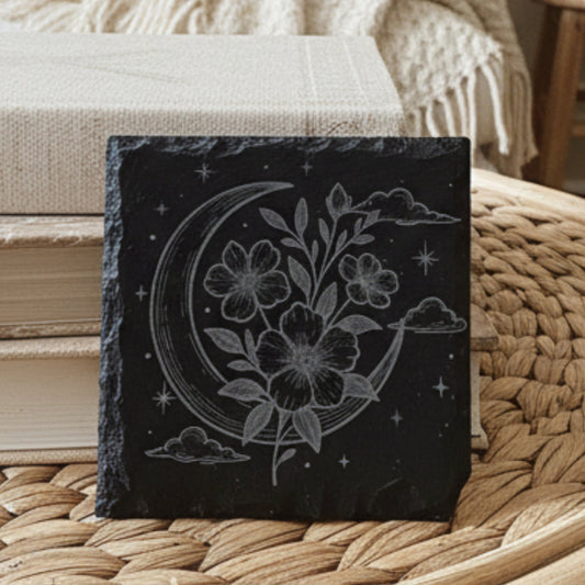 Decorative slate tile with floral crescent moon design.