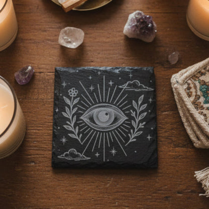 Decorative engraved slate tile with celestial boho eye design and floral elements.