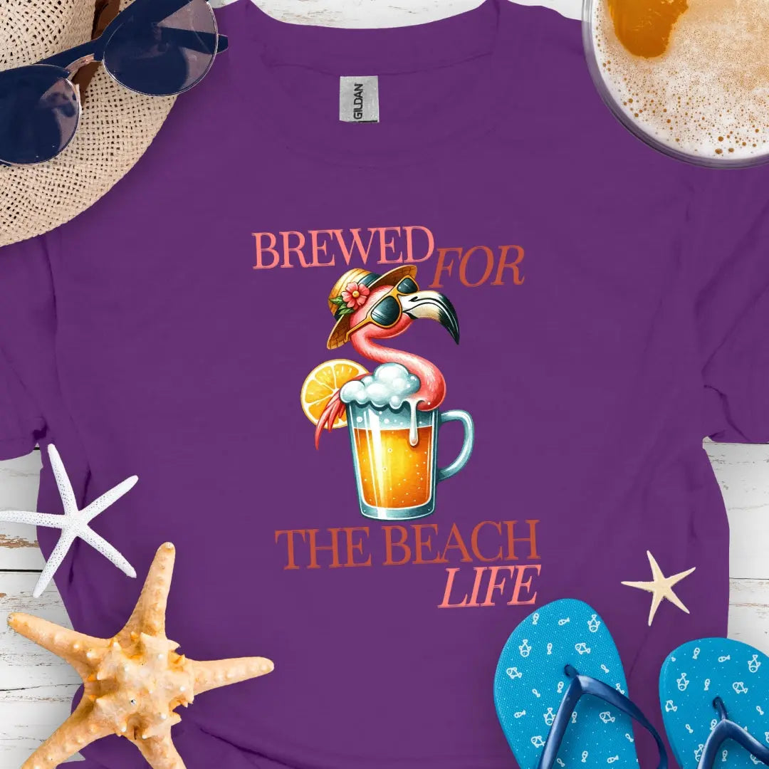 Purple t-shirt with cocktail and flamingo that says Brewed for the Beach Life.