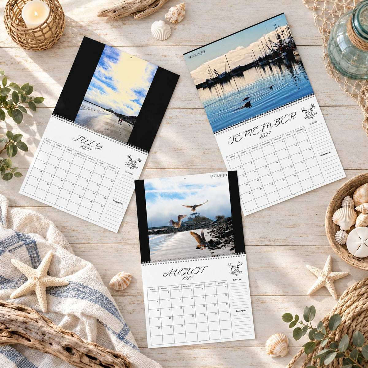 2027 Crescent City wall calendar monthly planning grid with to-do list and shopping list featuring Twelve Point Pics photography by Sean Staggs featuring beaches, ocean waves, wildlife, harbor scenes, sunsets and Battery Point Lighthouse Quarter 3.
