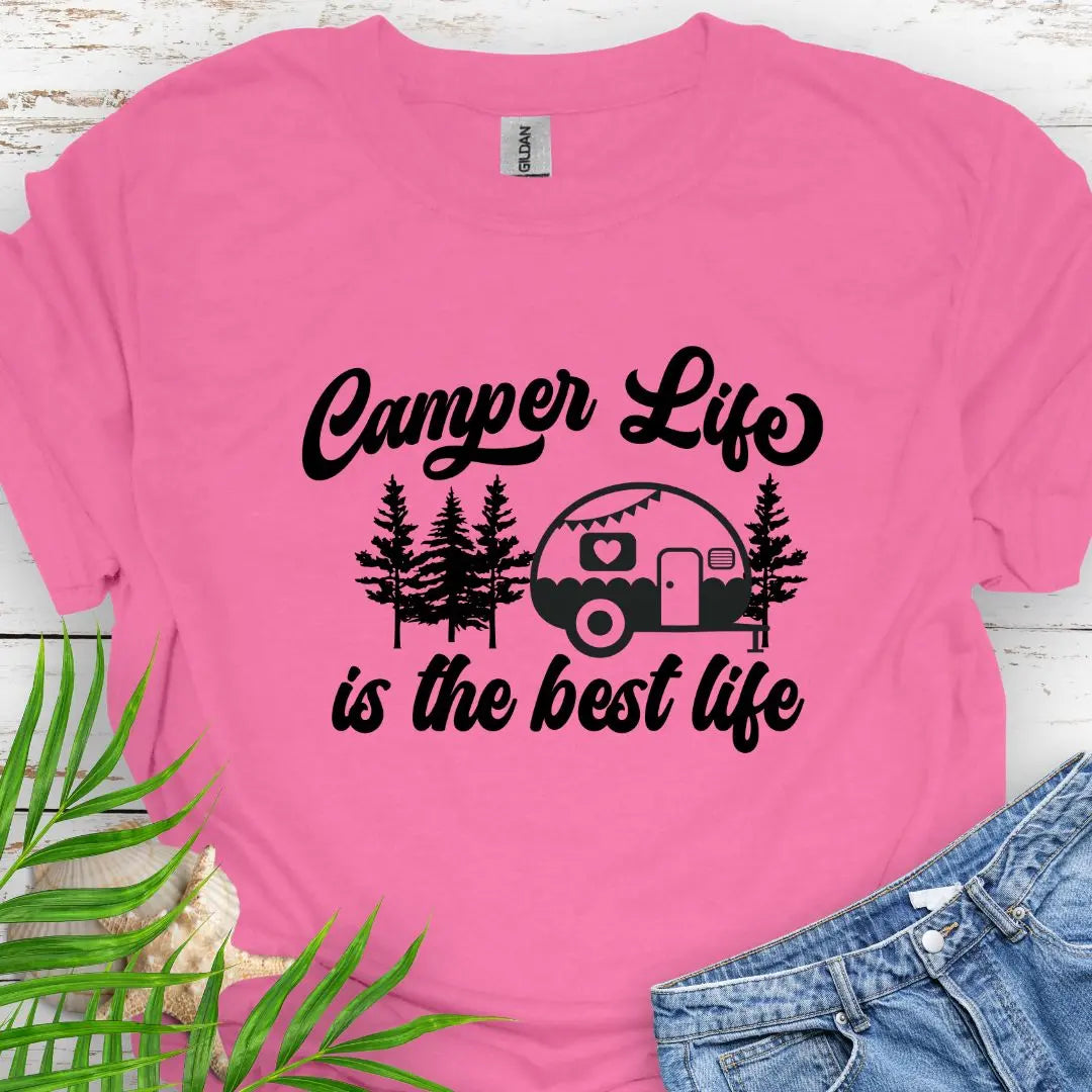 A cute vintage camper among the forest that says Camper Life is the good life in Azalea.