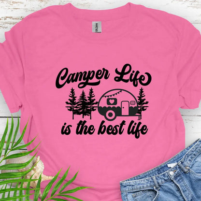 A cute vintage camper among the forest that says Camper Life is the good life in Azalea.