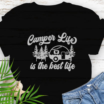 A cute vintage camper among the forest that says Camper Life is the good life in Black.