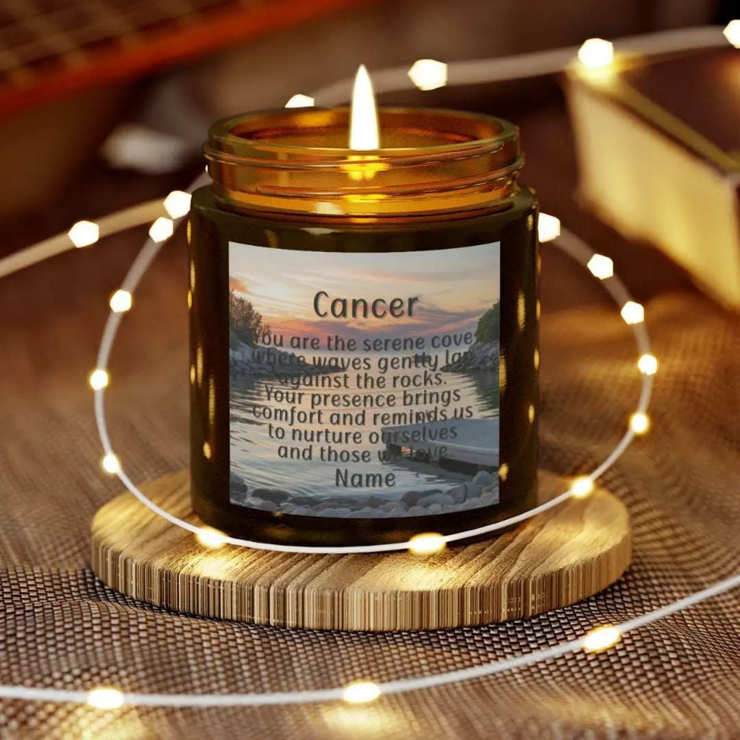 Elegant Cancer Zodiac hand-poured coconut apricot wax scented candle in a 4 oz amber glass jar, featuring a serene water and boat dock scene at sunset and an inspirational quote personalized. A beach-inspired astrology gift, perfect for relaxation and decor.