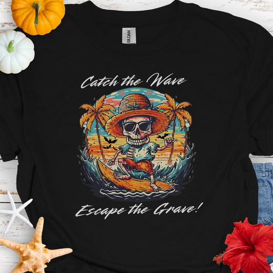 Black T-shirt with Skeleton surfing that says Catch the Wave