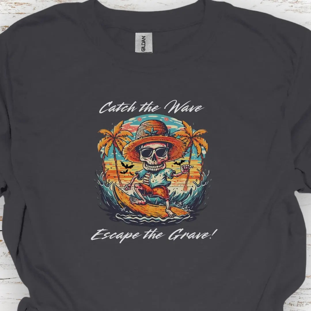 Charcoal T-shirt with Skeleton surfing that says Catch the Wave