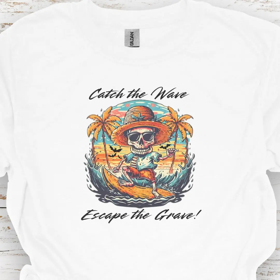 White T-shirt with Skeleton surfing that says Catch the Wave