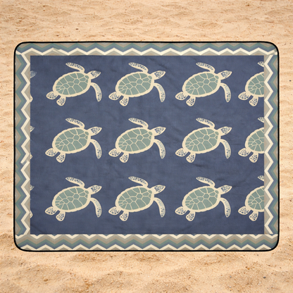 Outdoor beach blanket with sea turtle pattern with chevron frame.