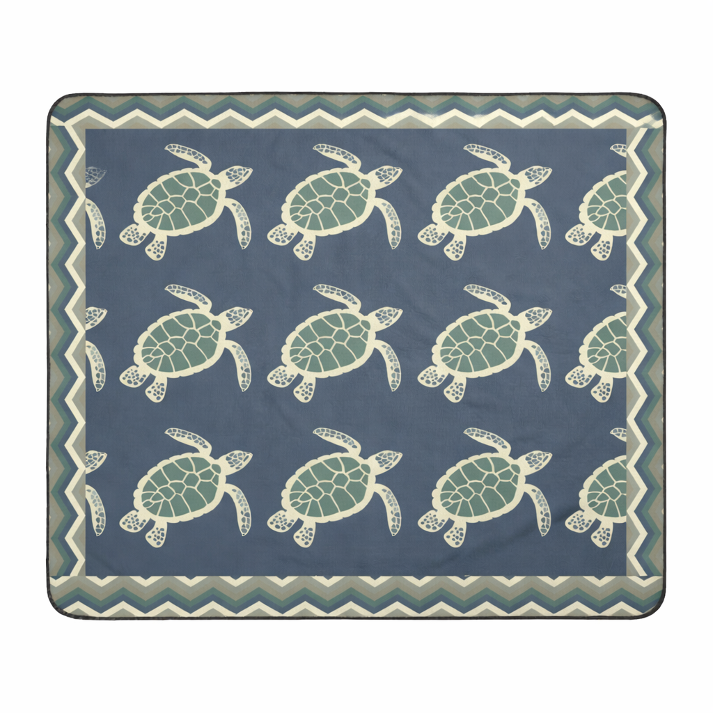 Blanket with sea turtle pattern on a blue background and chevron frame.
