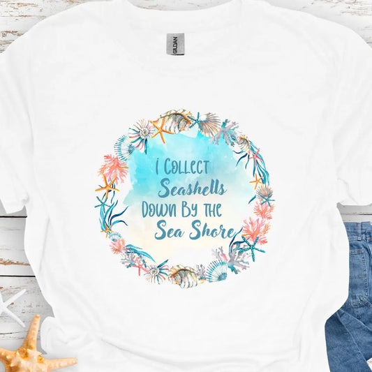 White t-shirt with seashell wreath with text I collect Sea shells by the Seashore