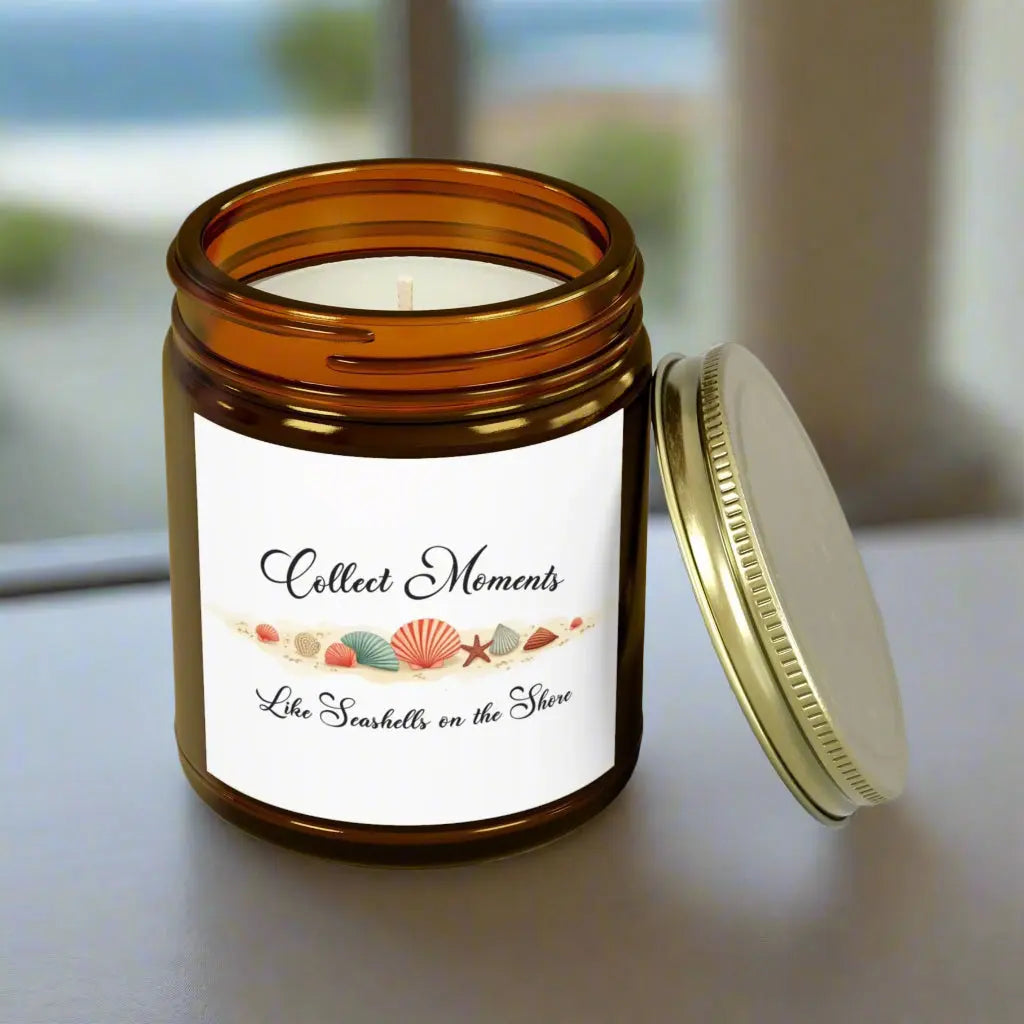Elegant hand-poured coconut apricot wax scented candle in a 9 oz amber glass jar, featuring the quote "Collect Moments Like Seashells on the Shore" with a seashell design. A cozy beach-inspired gift, perfect for relaxation and decor.