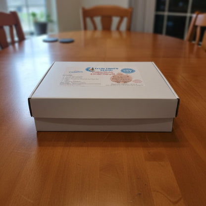 White box with branding on a wooden table